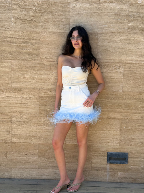 Мініспідниця з пір'ям біла